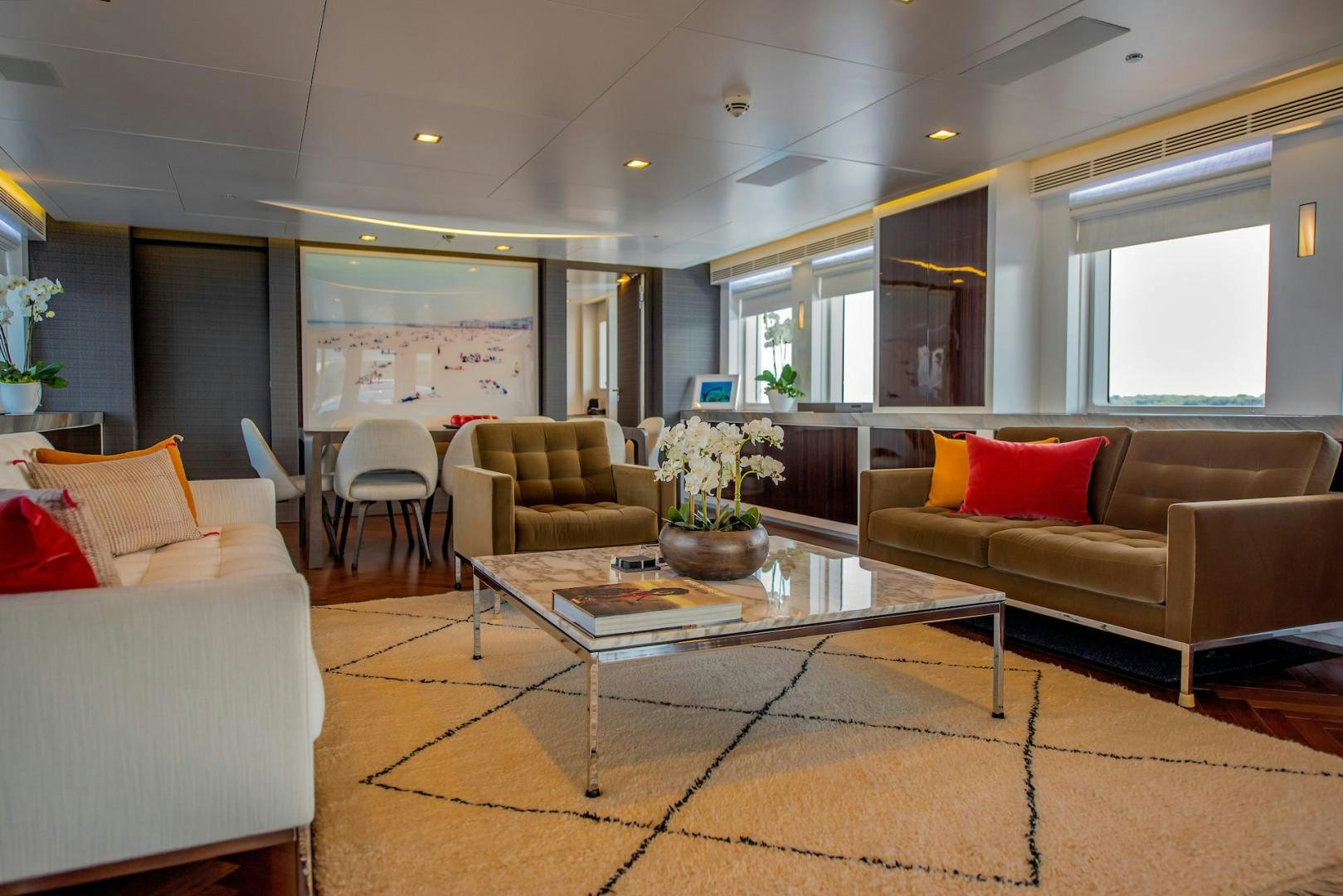 a living room with a table and chairs aboard OCEAN'S SEVEN Yacht for Sale
