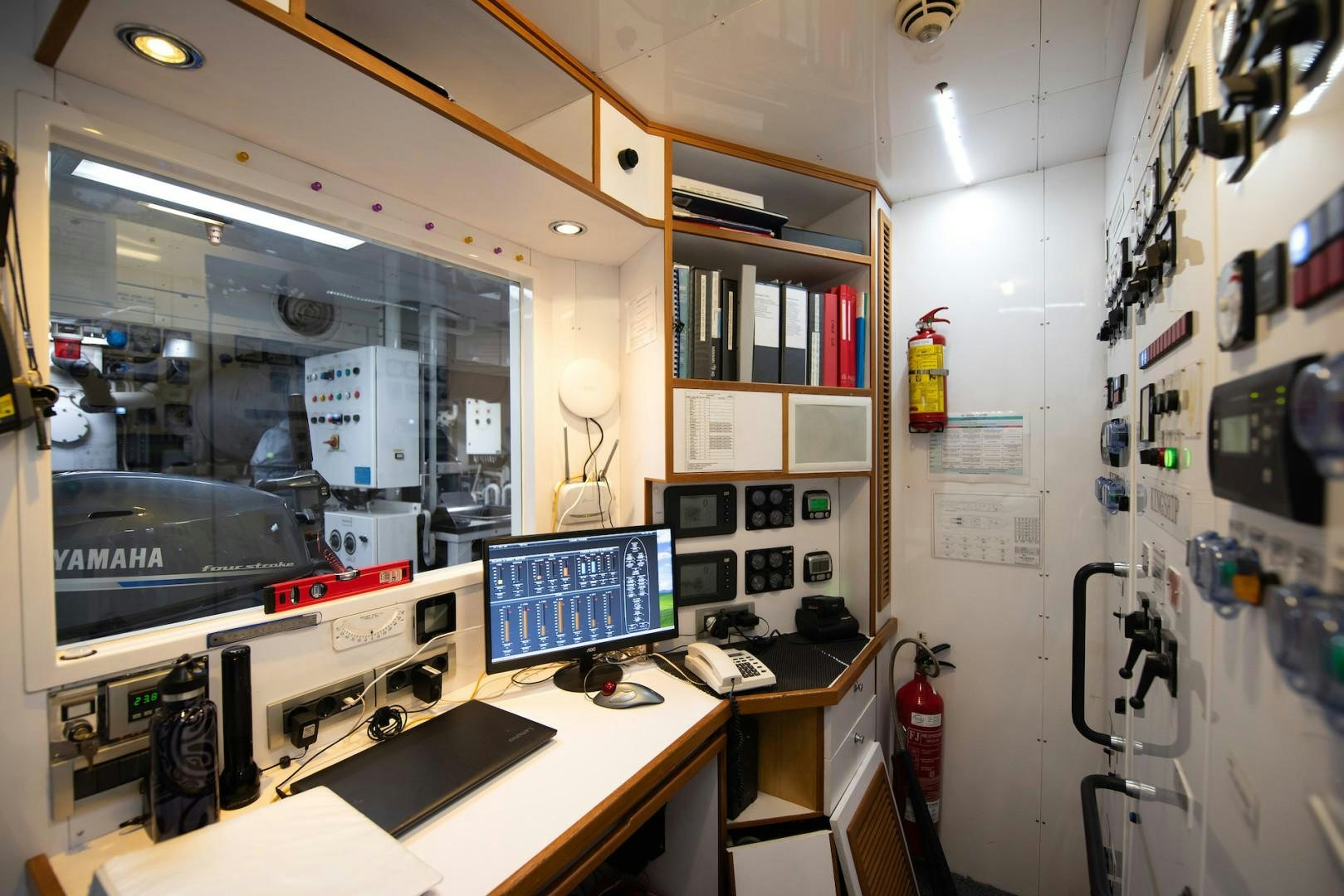 a room with a desk and computer aboard OCEAN'S SEVEN Yacht for Sale