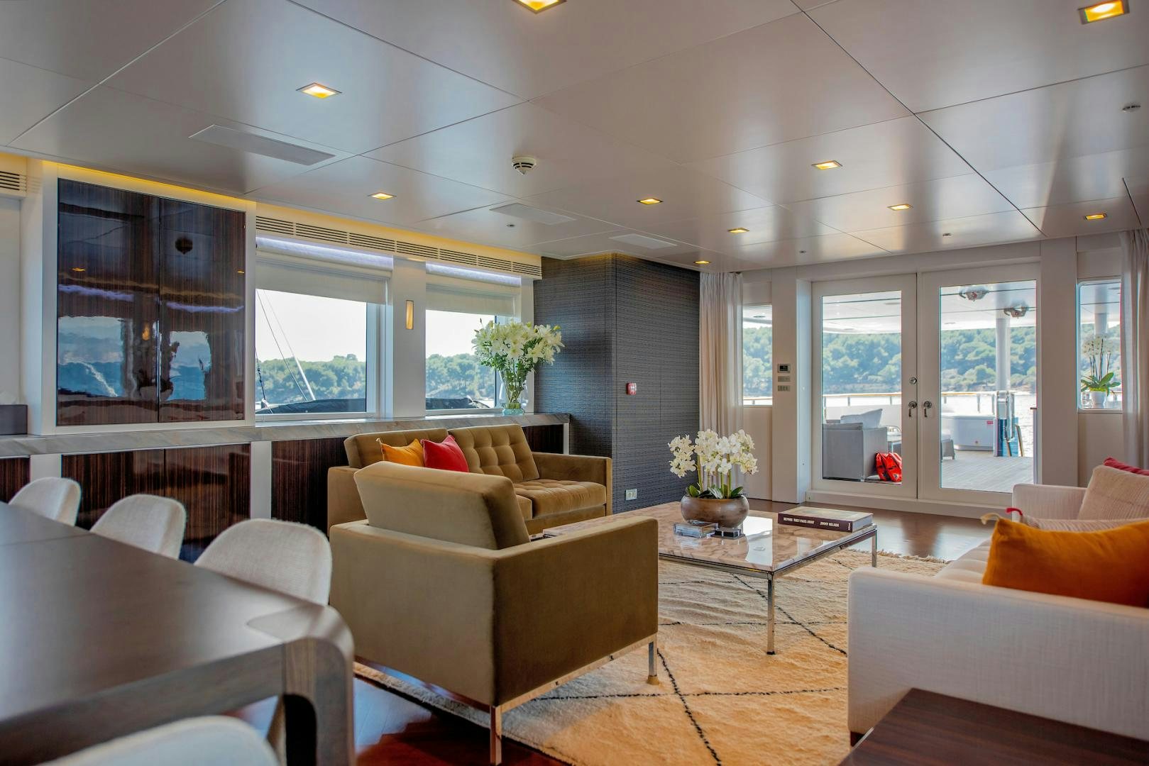 a room with couches and tables aboard OCEAN'S SEVEN Yacht for Sale