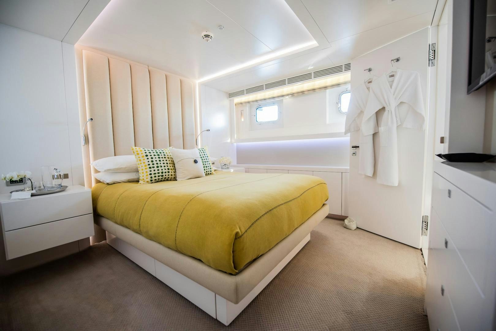 a bedroom with a bed and a closet aboard OCEAN'S SEVEN Yacht for Sale
