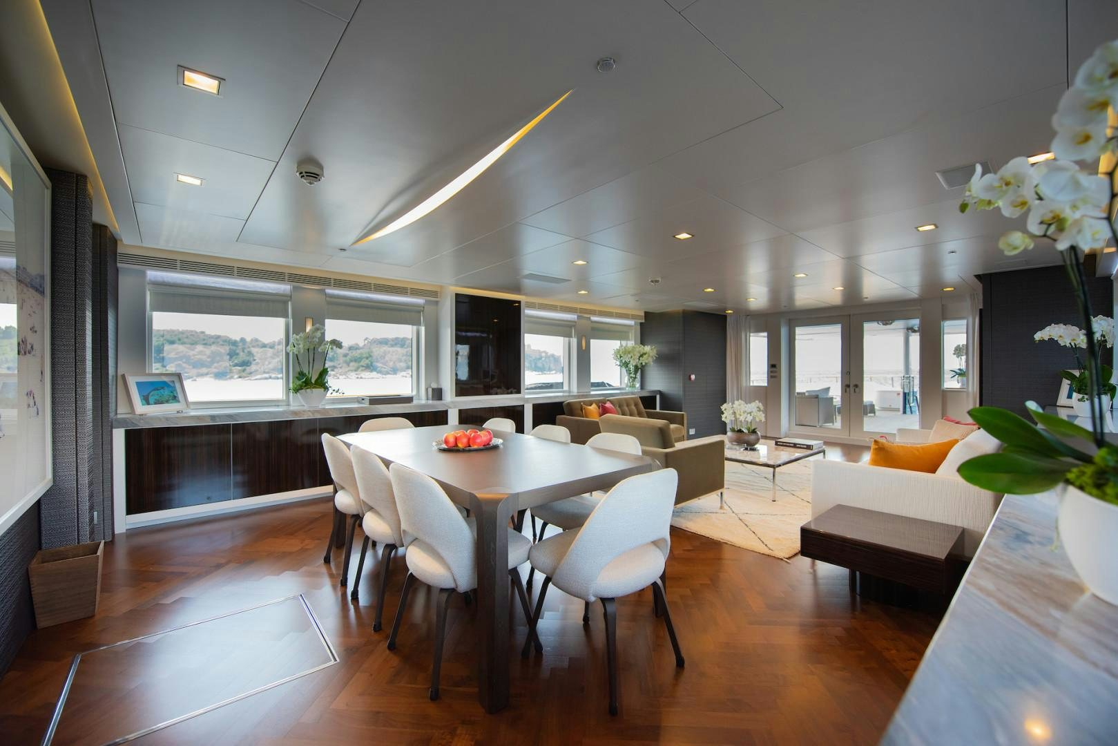 a large room with tables and chairs aboard OCEAN'S SEVEN Yacht for Sale