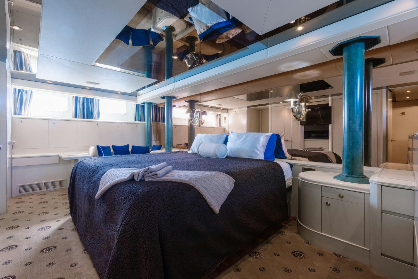 a room with a bed and a desk aboard LORI LYNN Yacht for Sale