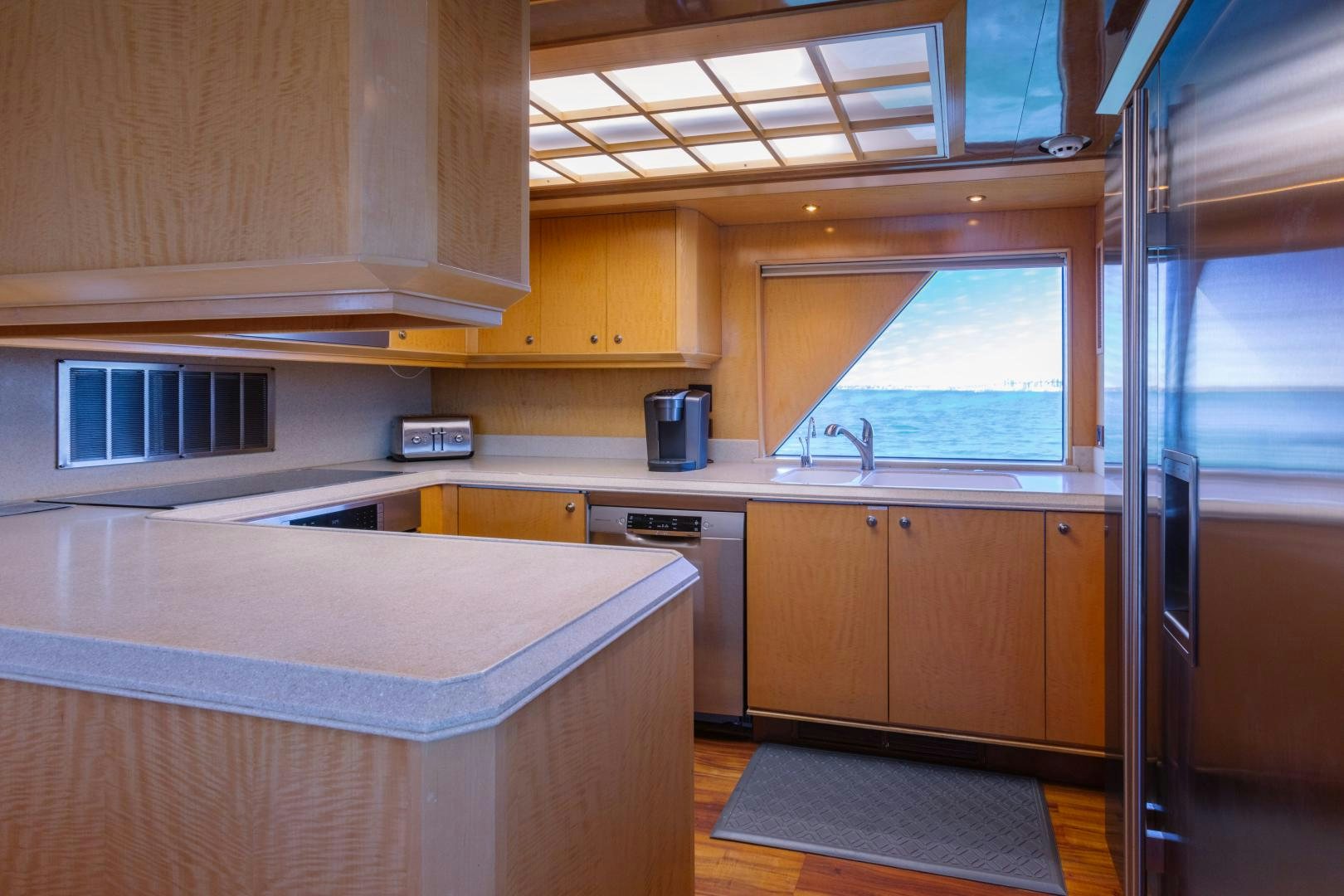 a kitchen with a sink and cabinets aboard LORI LYNN Yacht for Sale