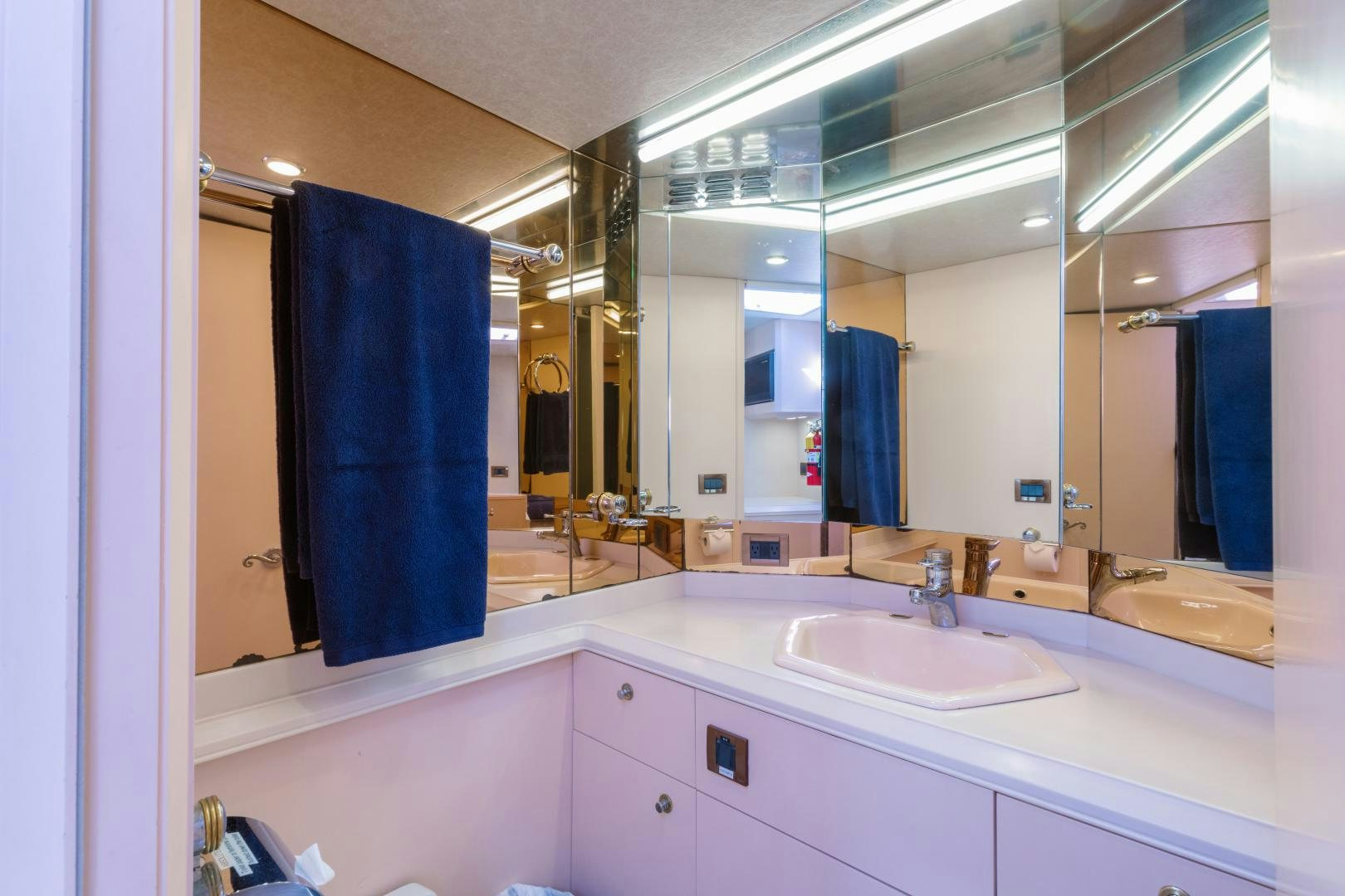 a bathroom with a large mirror aboard LORI LYNN Yacht for Sale