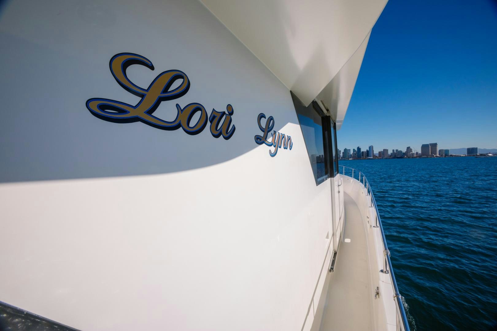 a boat with a logo on the front aboard LORI LYNN Yacht for Sale