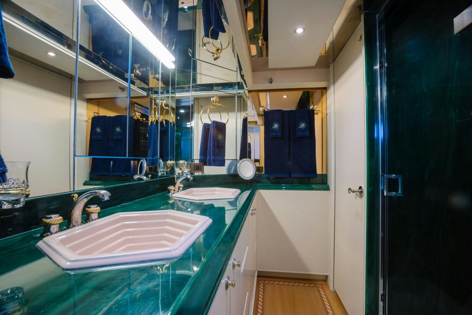 a bathroom with a sink and a mirror aboard LORI LYNN Yacht for Sale