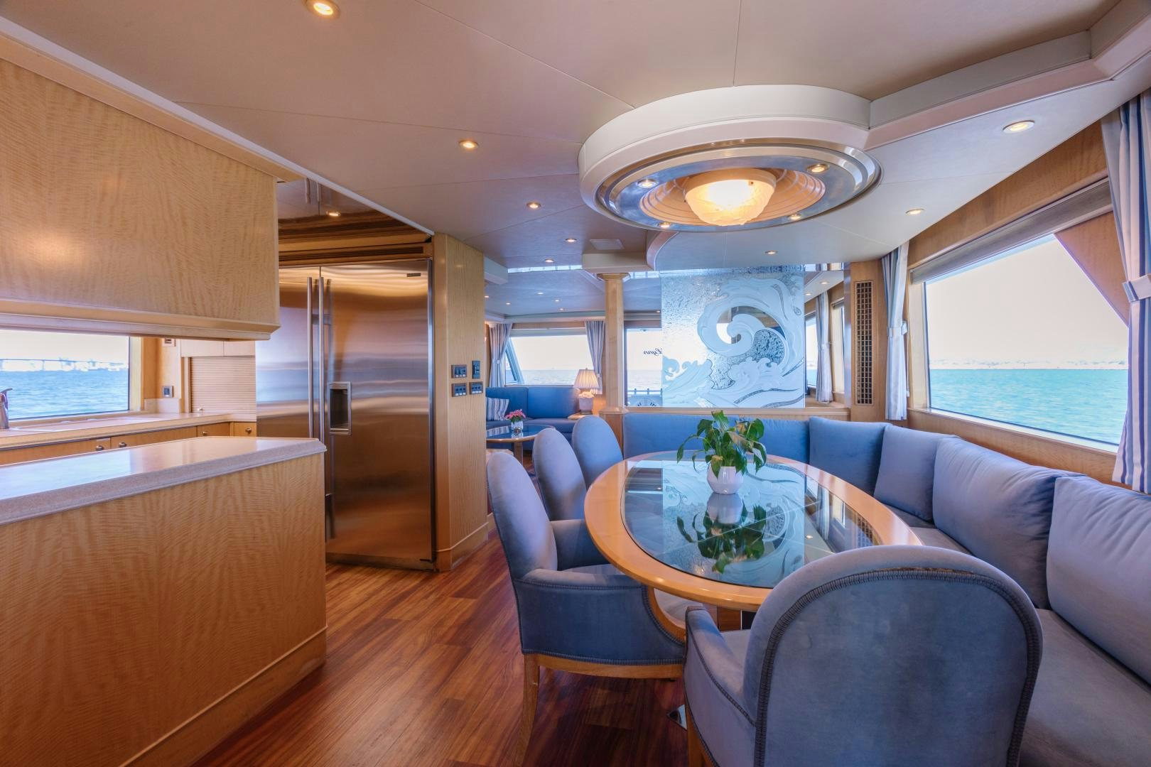 a room with a table and chairs aboard LORI LYNN Yacht for Sale