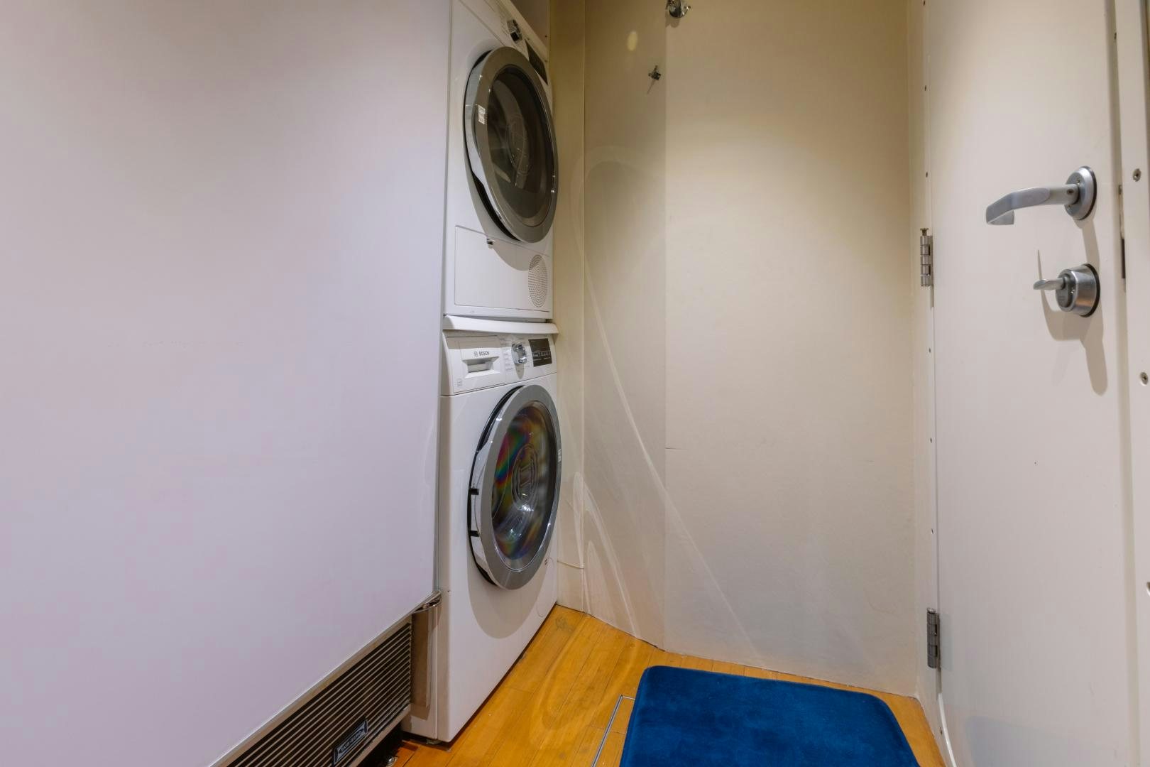 a white door with a washing machine aboard LORI LYNN Yacht for Sale