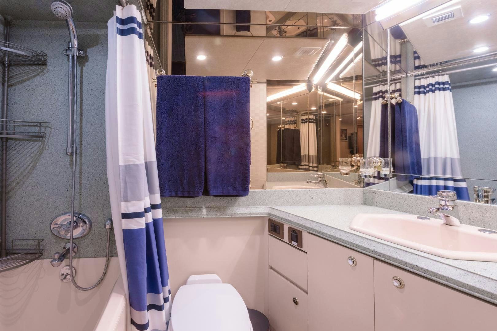 a bathroom with a shower curtain aboard LORI LYNN Yacht for Sale
