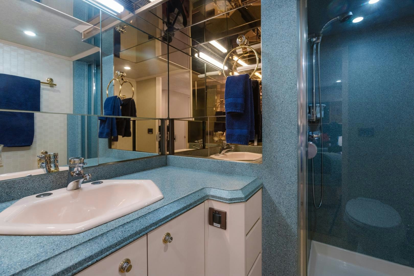 a bathroom with a large mirror aboard LORI LYNN Yacht for Sale