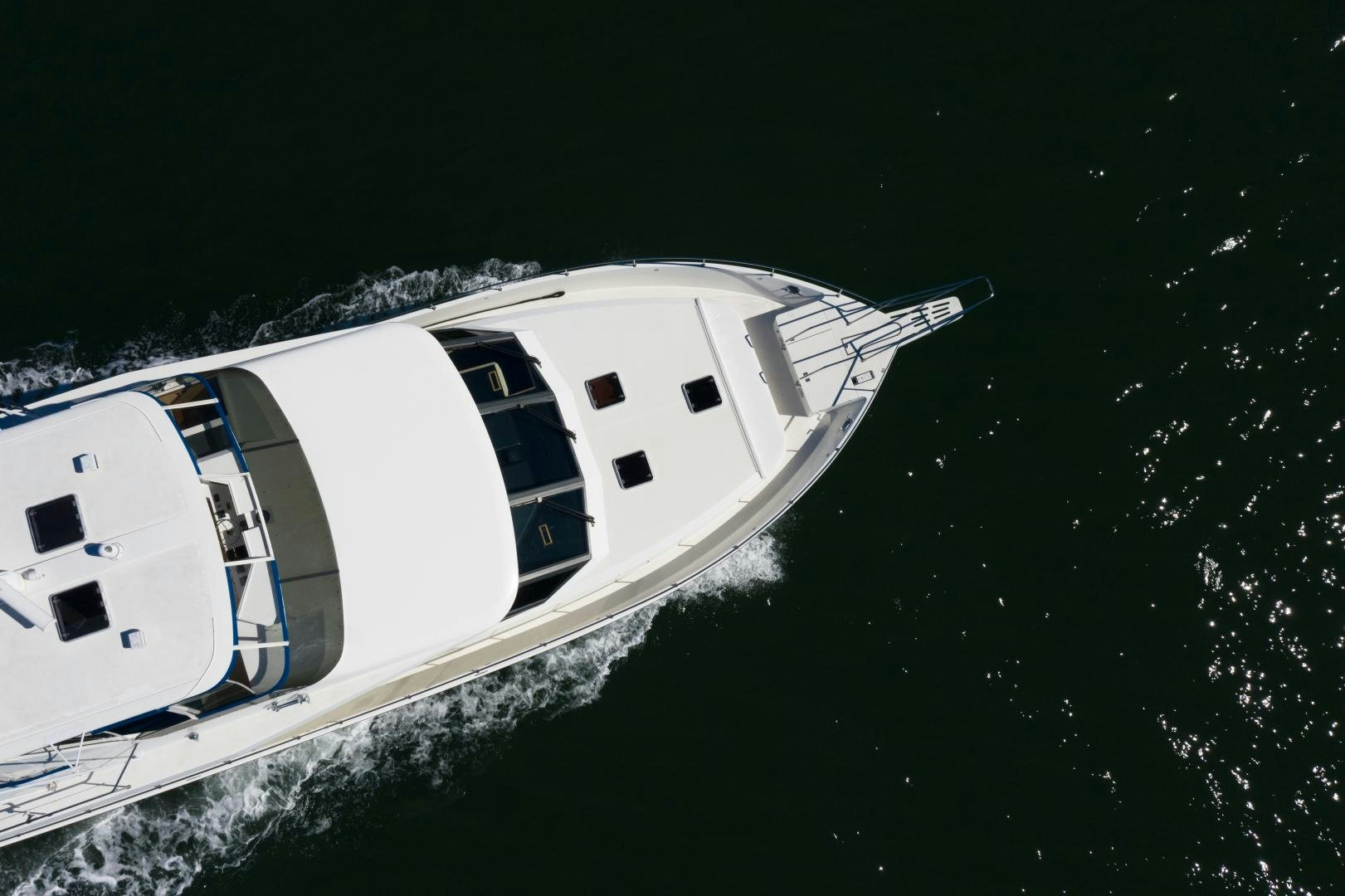 a white yacht in the water aboard LORI LYNN Yacht for Sale