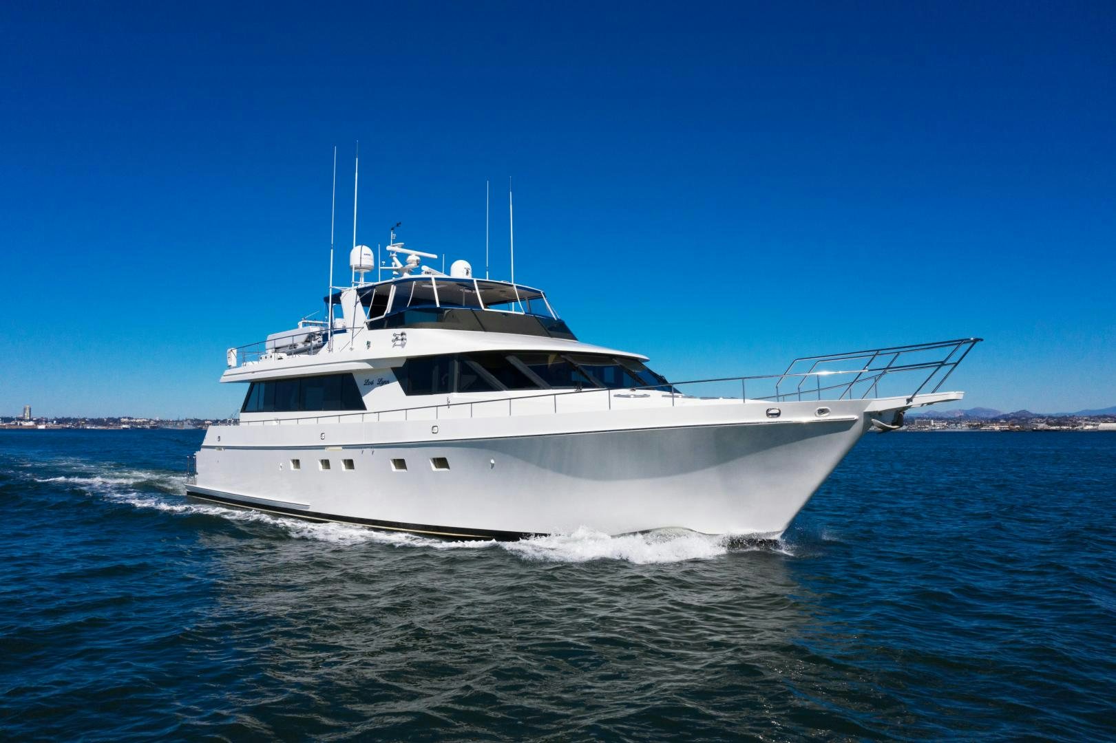 a white boat on the water aboard LORI LYNN Yacht for Sale