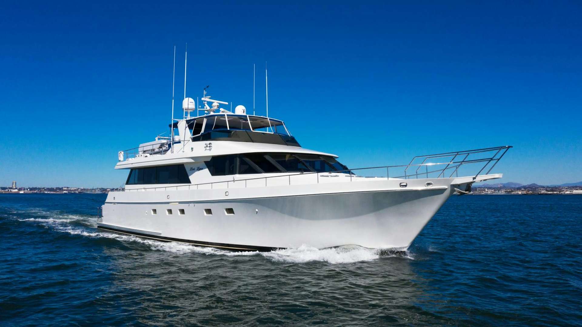 a white boat on the water aboard Lori lynn Yacht for Sale