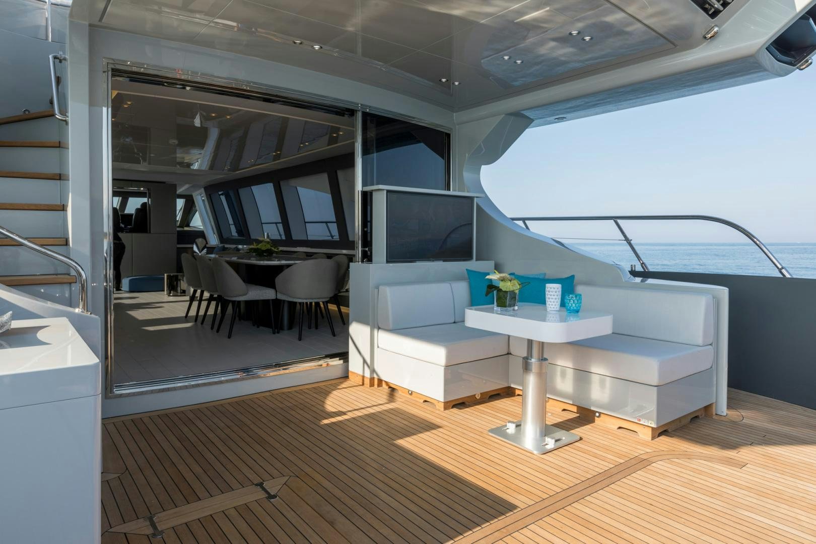 a room with a table and chairs aboard NANA I Yacht for Sale