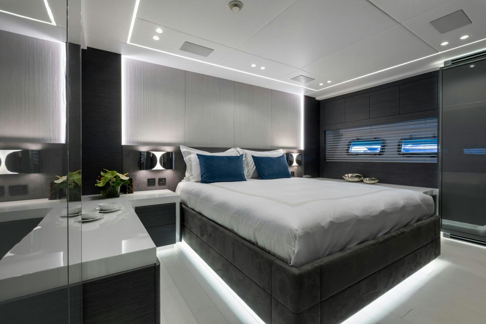 a room with a bed and a desk aboard NANA I Yacht for Sale