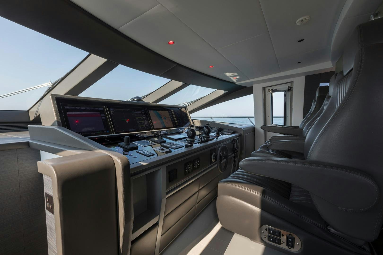 inside of a vehicle with a large screen and many screens aboard NANA I Yacht for Sale