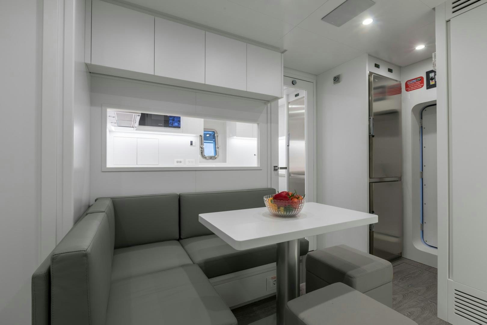 a room with a couch and a table aboard NANA I Yacht for Sale