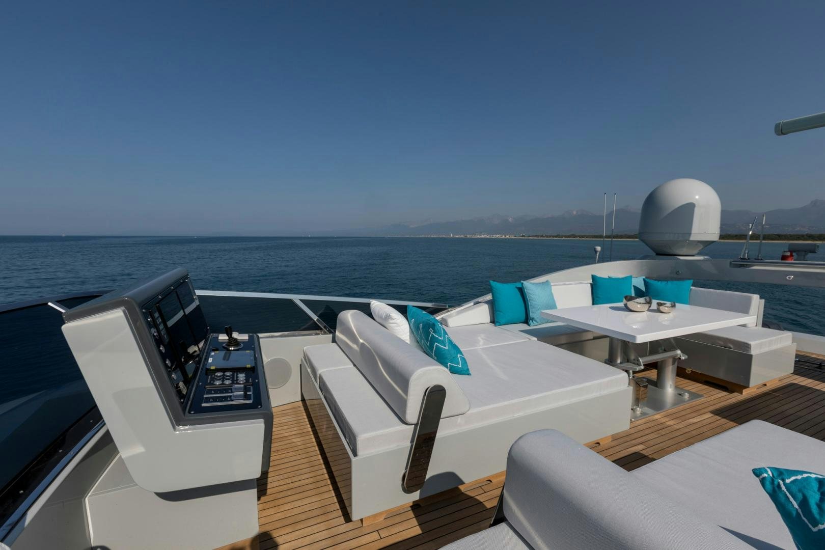 a deck with a large white chair and a large white globe on the deck and a large white aboard NANA I Yacht for Sale