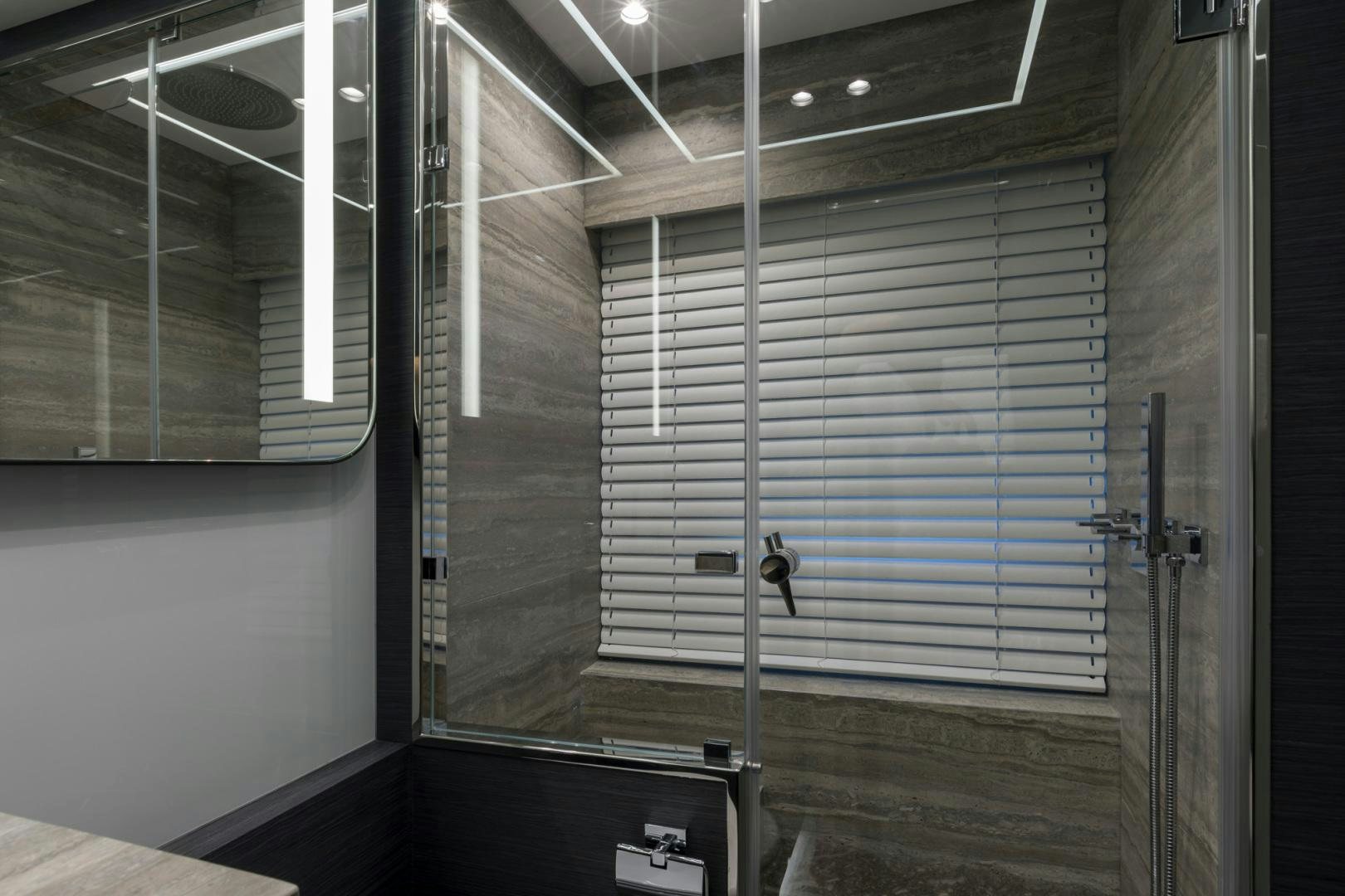 a room with a window and a door aboard NANA I Yacht for Sale