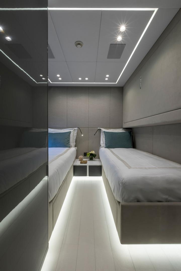 a room with a couple of beds aboard NANA I Yacht for Sale