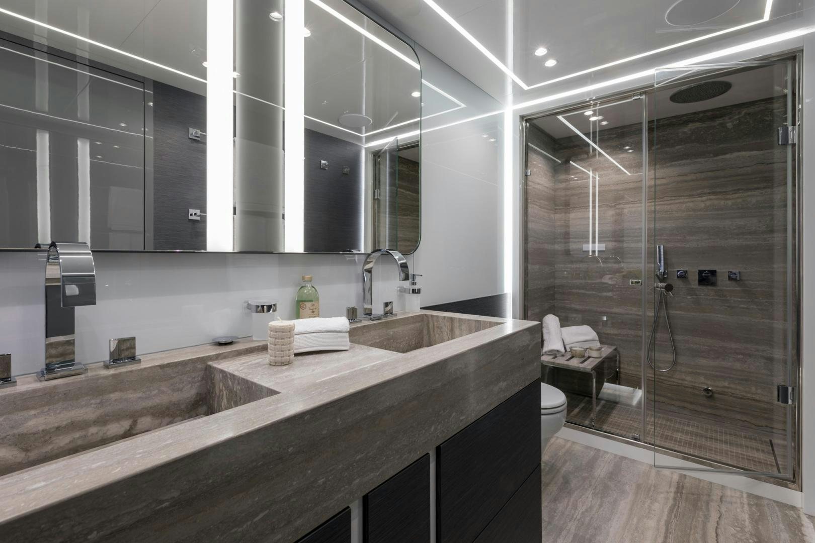 a bathroom with a sink and a shower unit aboard NANA I Yacht for Sale