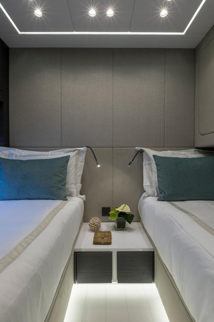 a room with two beds aboard NANA I Yacht for Sale