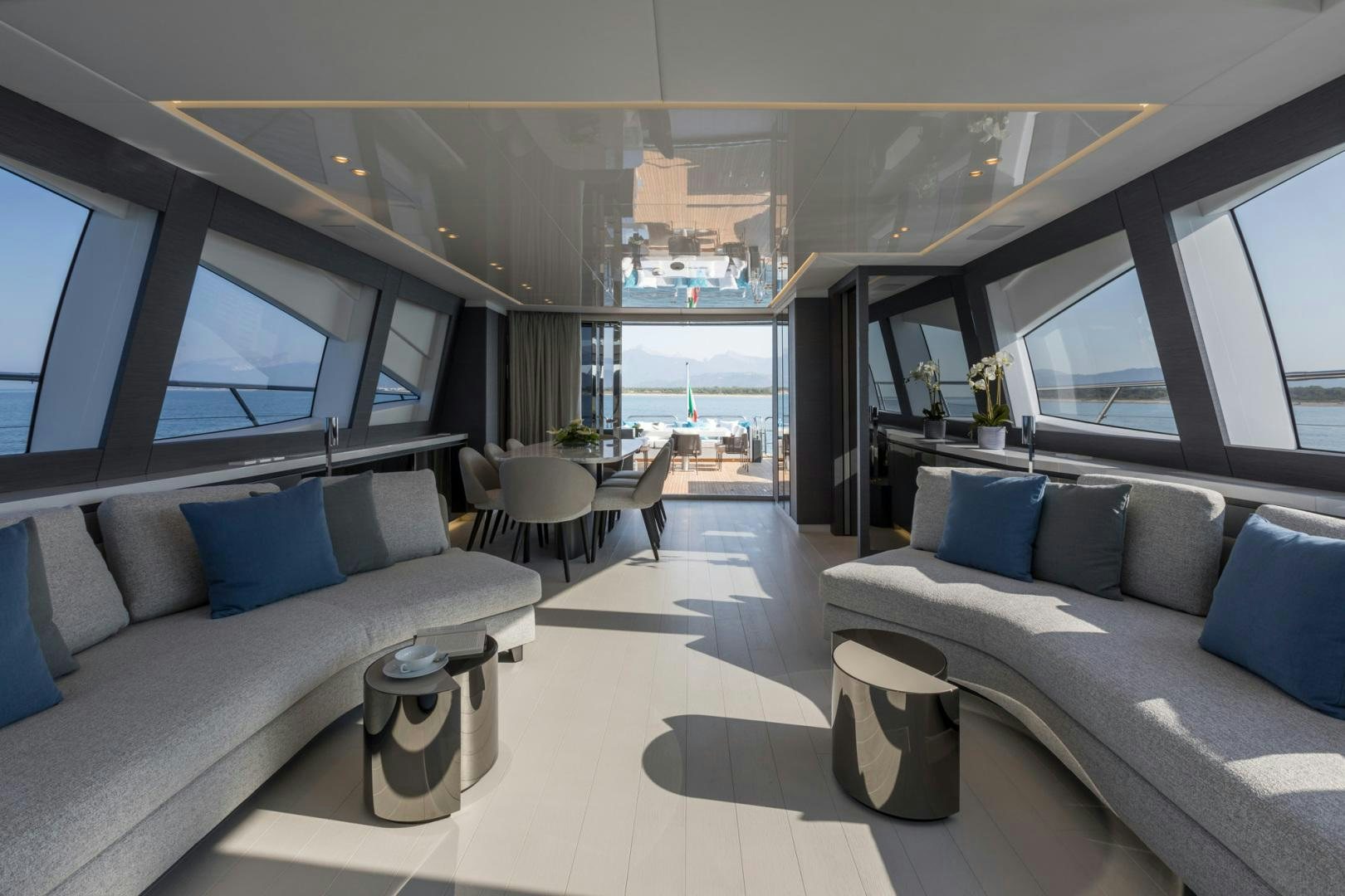 a room with a couch and a table and a window aboard NANA I Yacht for Sale