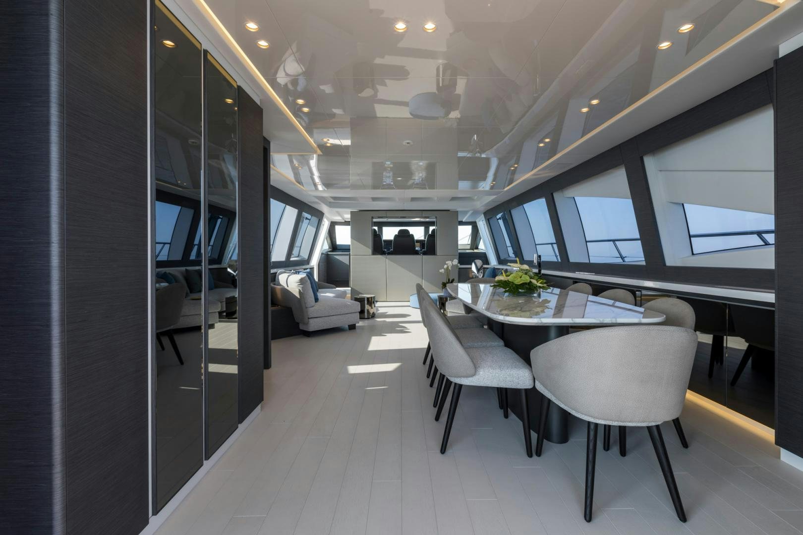 a room with a table and chairs aboard NANA I Yacht for Sale