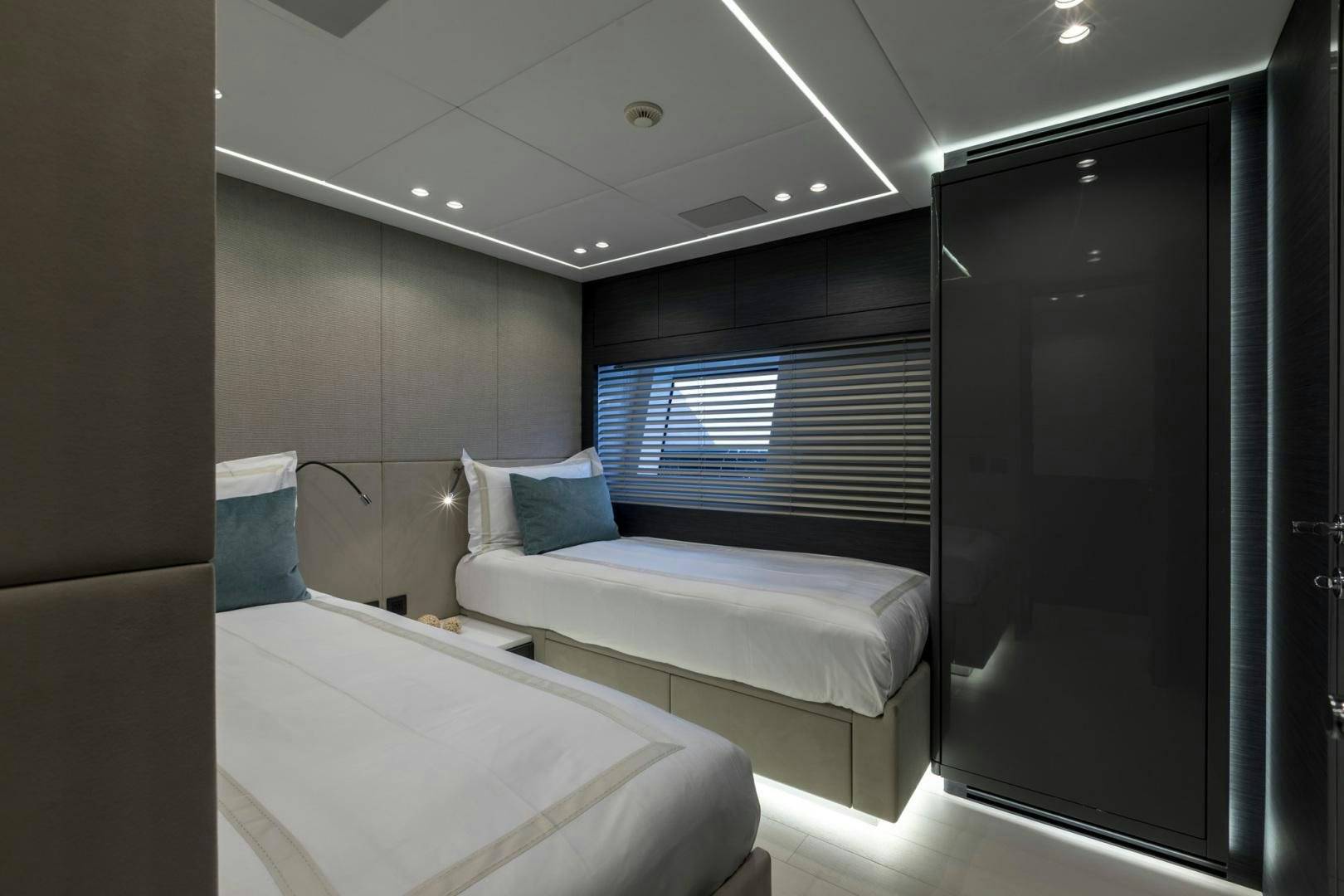 a room with a bed and a window aboard NANA I Yacht for Sale