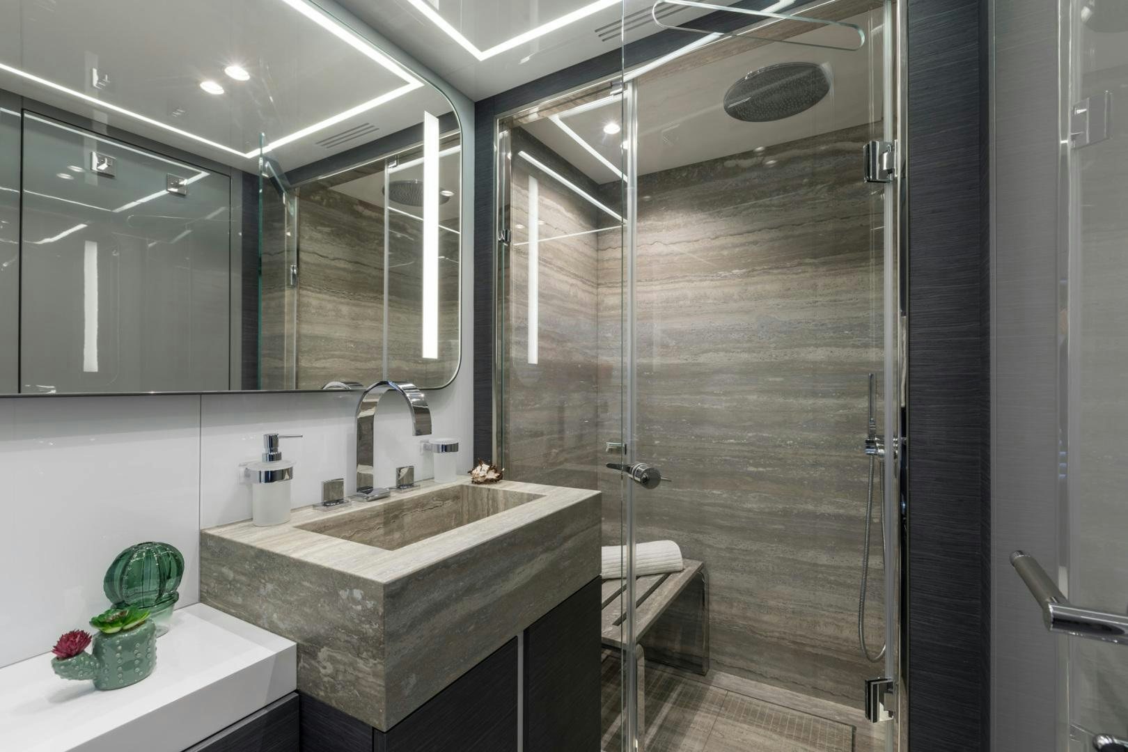 a bathroom with a shower unit and sink aboard NANA I Yacht for Sale