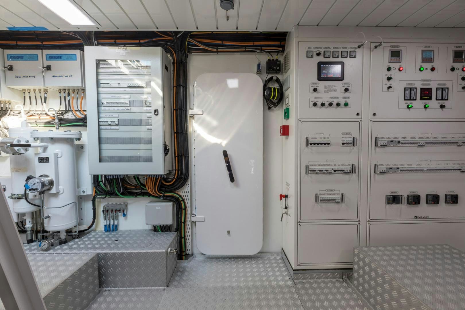 a room with white machines aboard NANA I Yacht for Sale