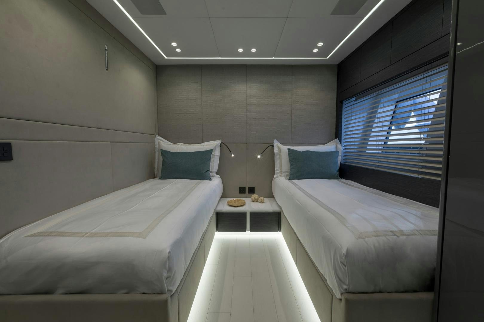 a room with two beds aboard NANA I Yacht for Sale