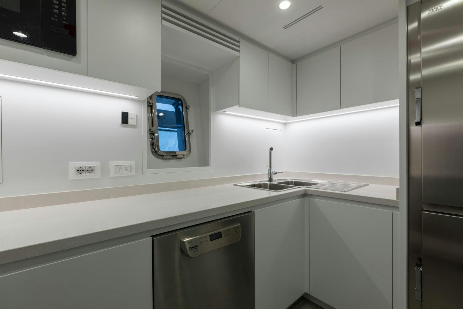 a computer on a counter aboard NANA I Yacht for Sale