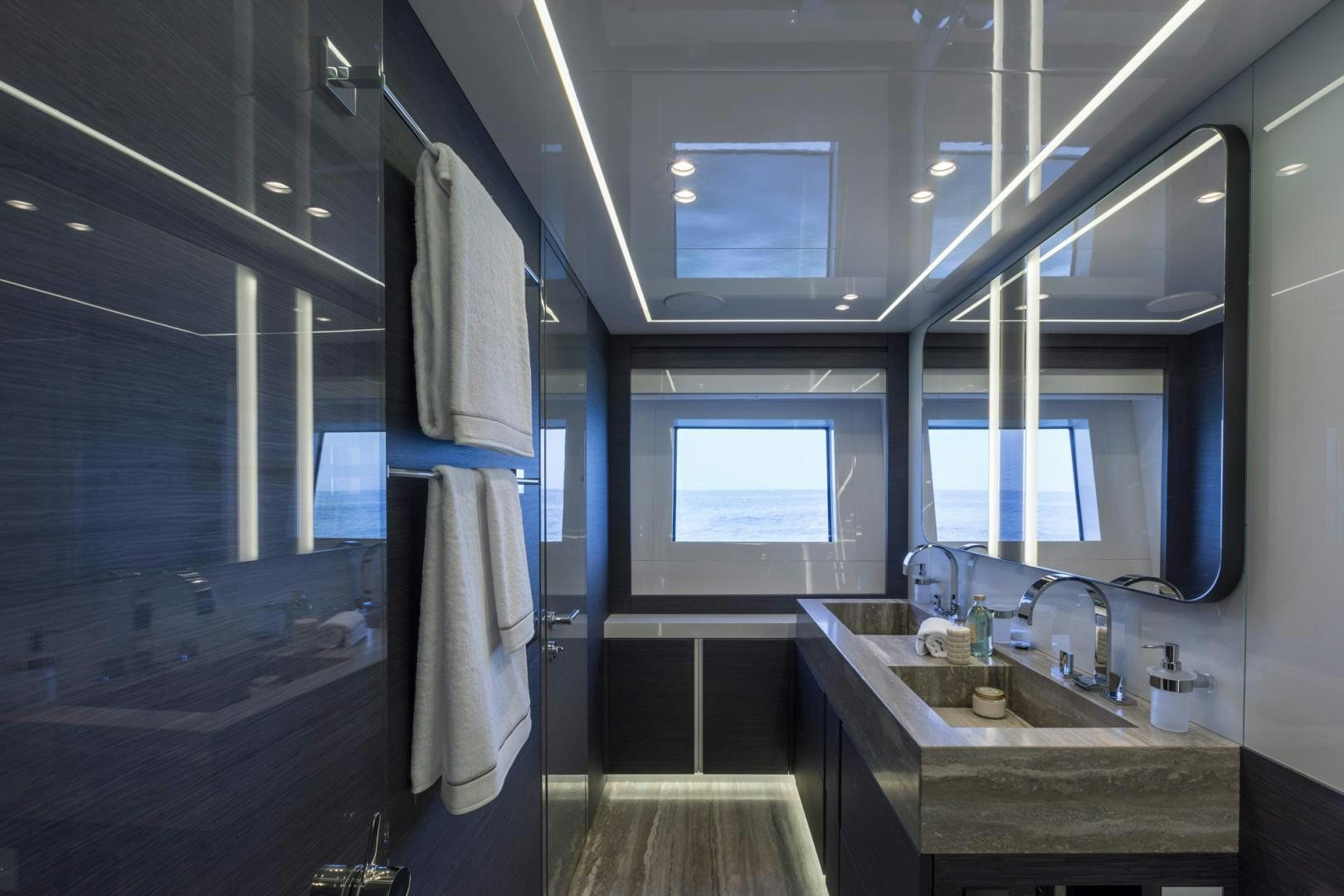 a bathroom with a sink and a mirror aboard NANA I Yacht for Sale