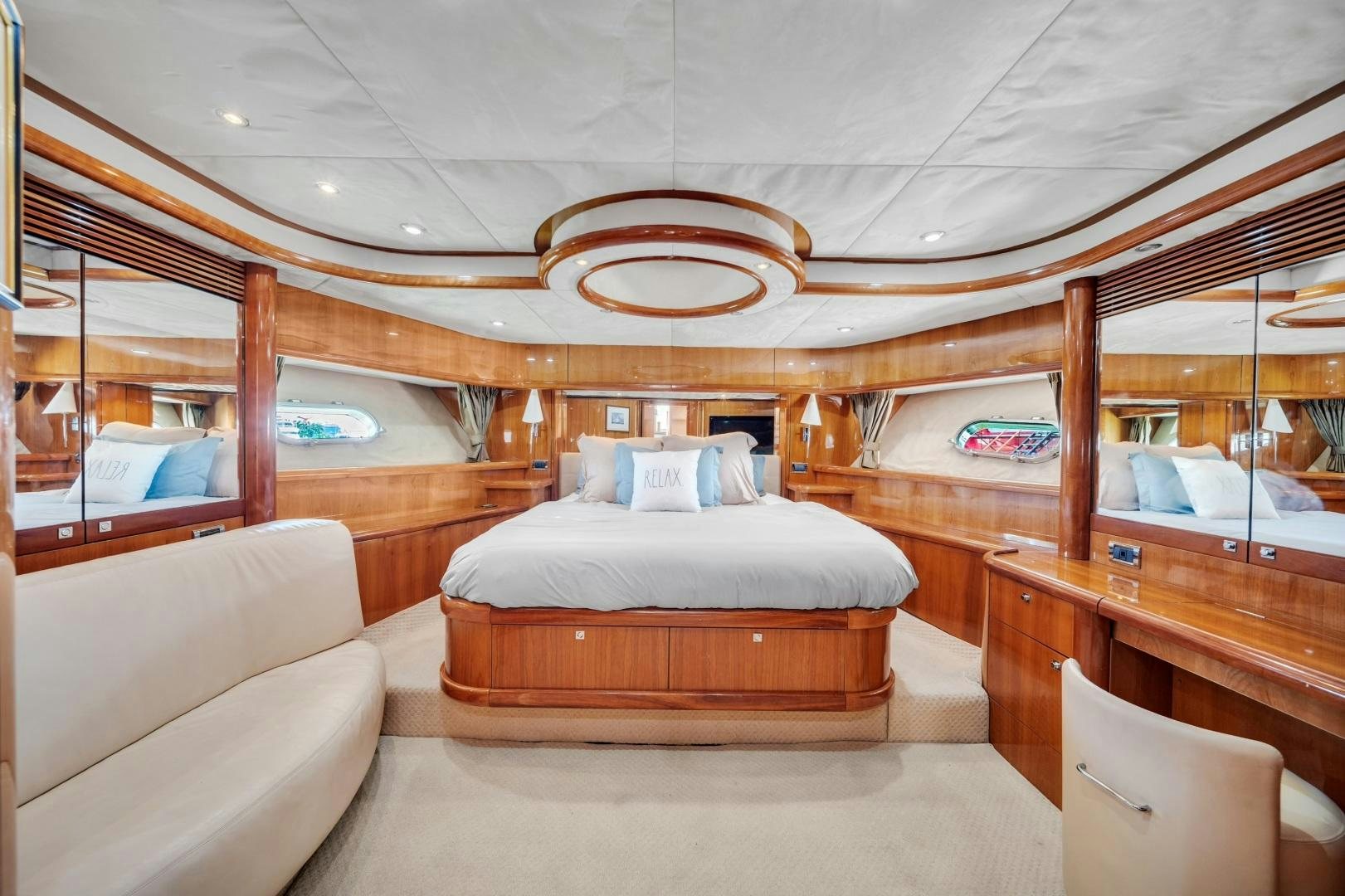 a cabin with a bed and a couch aboard FINS UP Yacht for Sale