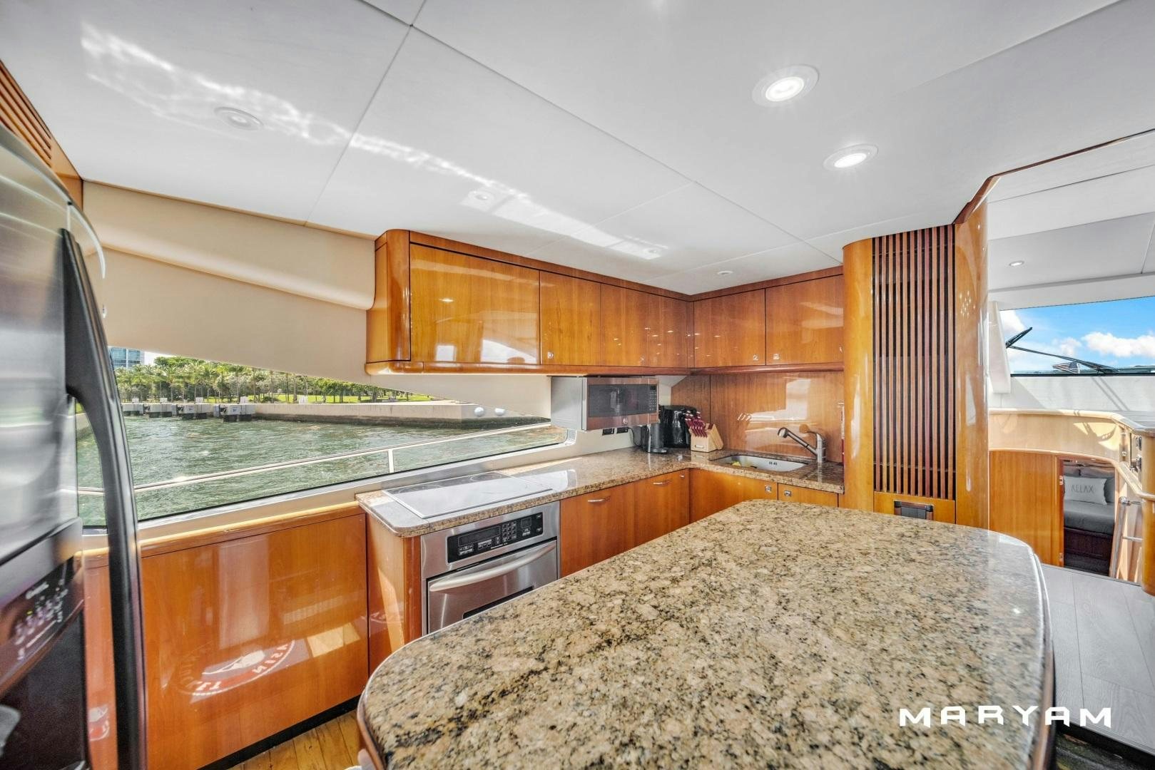 a kitchen with a large island aboard FINS UP Yacht for Sale