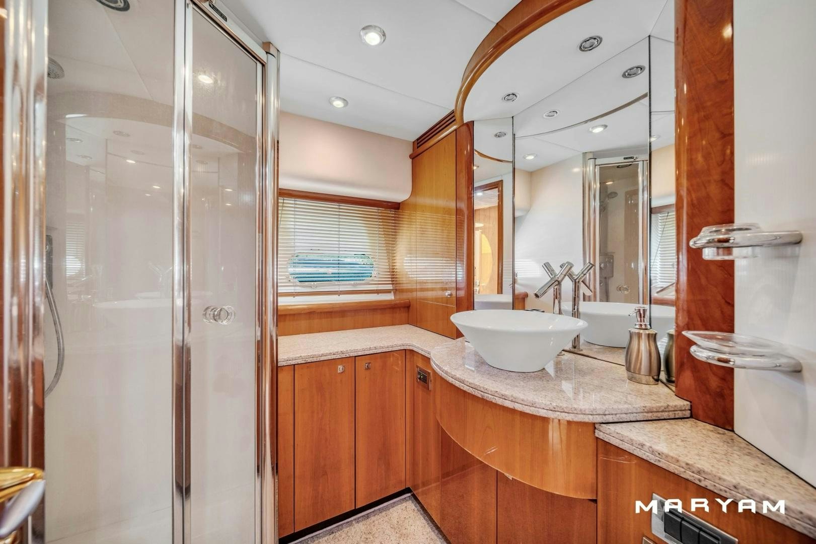 a bathroom with a sink and a mirror aboard FINS UP Yacht for Sale