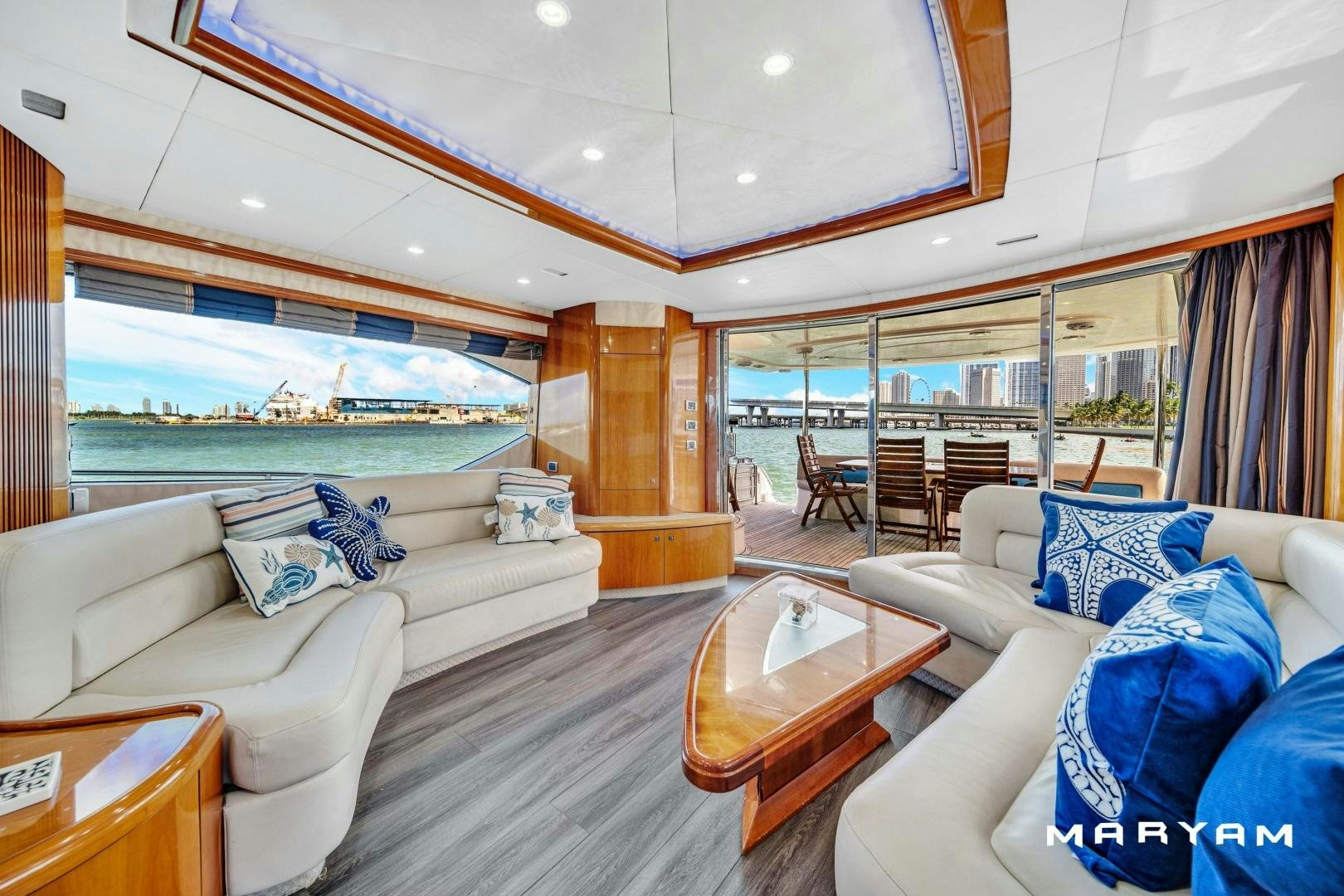 a living room with a large glass window aboard FINS UP Yacht for Sale