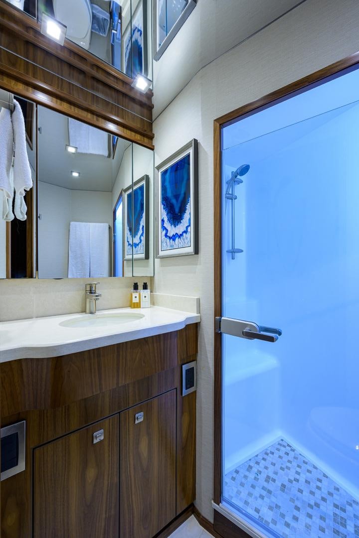 a bathroom with a sink and a mirror aboard PASTIME Yacht for Sale