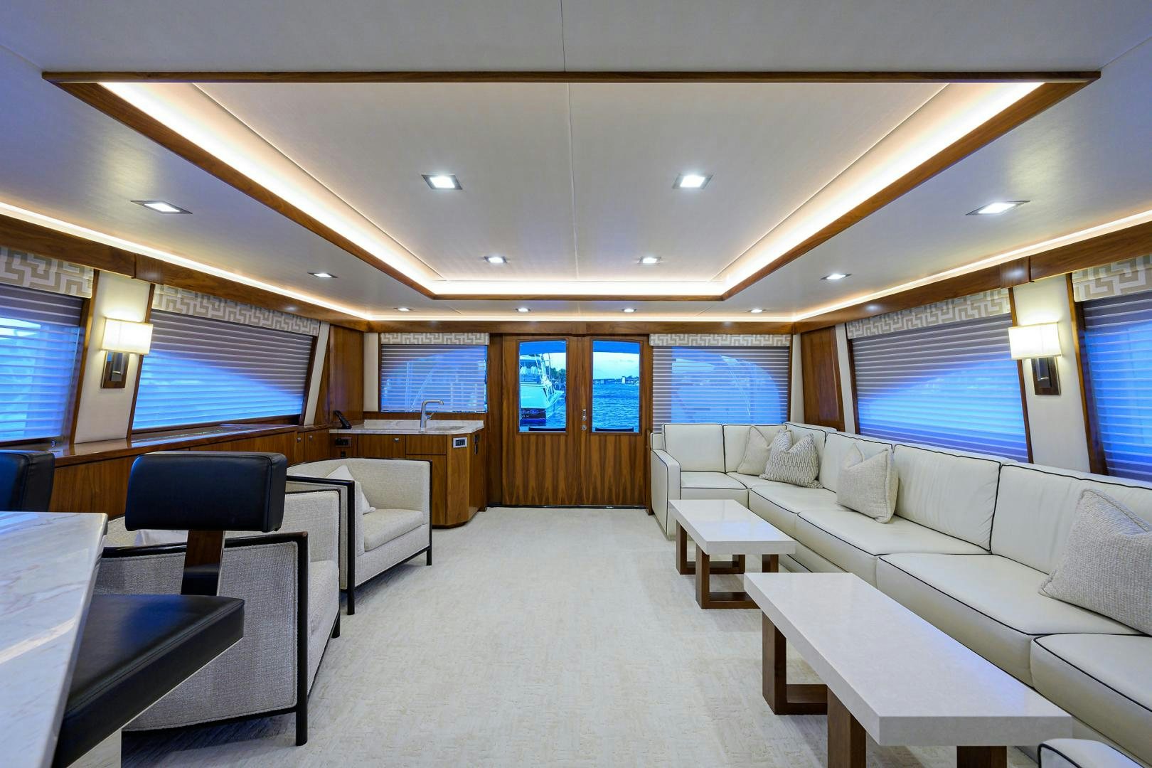 a room with a couch and a table and chairs aboard PASTIME Yacht for Sale