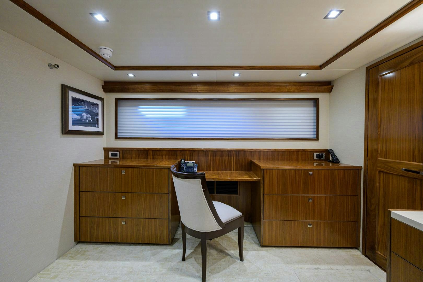 a room with a desk and a chair aboard PASTIME Yacht for Sale