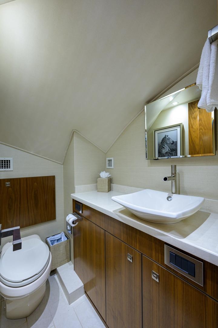 a bathroom with a sink and a toilet aboard PASTIME Yacht for Sale
