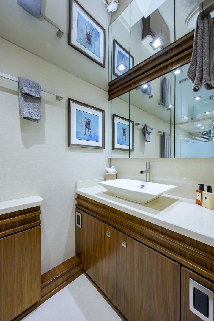 a bathroom with a sink and a mirror aboard PASTIME Yacht for Sale