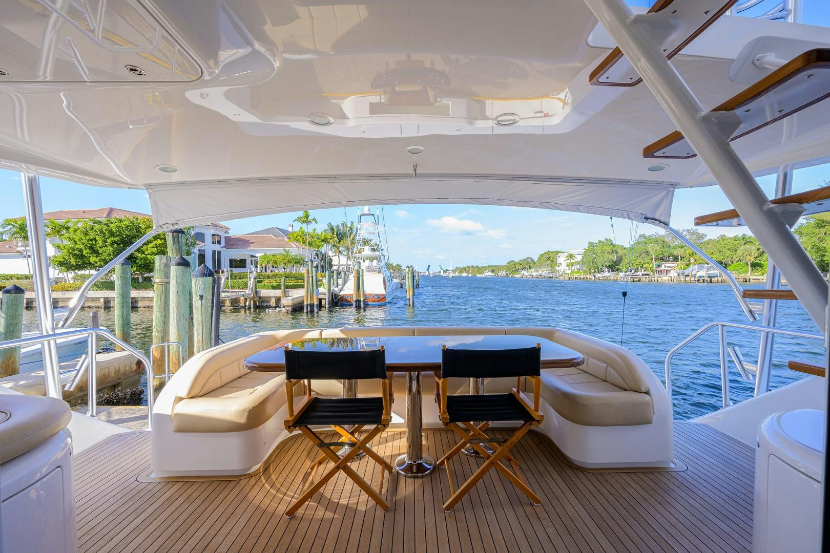 a room with a table and chairs on a deck aboard PASTIME Yacht for Sale