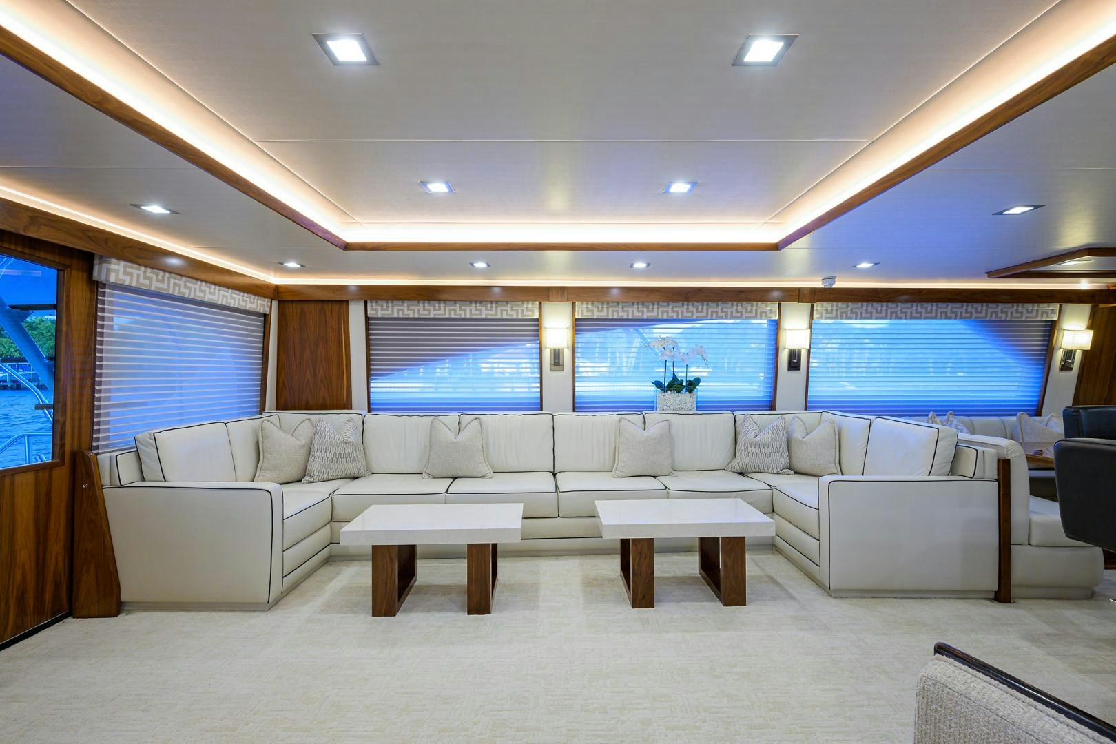 a room with a couch and a table and a television aboard PASTIME Yacht for Sale