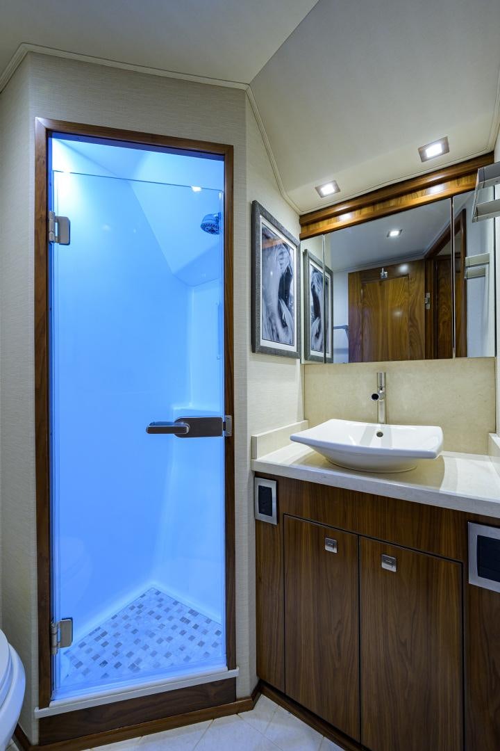 a bathroom with a blue door aboard PASTIME Yacht for Sale