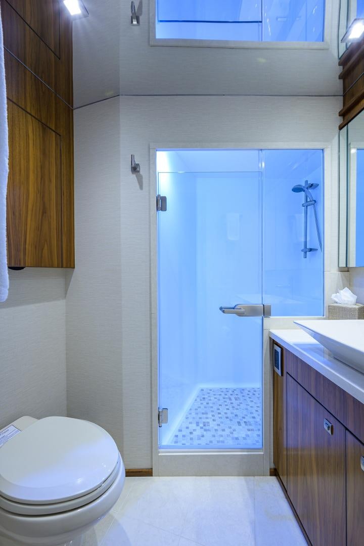 a bathroom with a shower and sink aboard PASTIME Yacht for Sale
