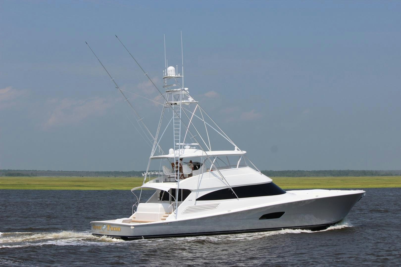 a white boat on the water aboard PASTIME Yacht for Sale