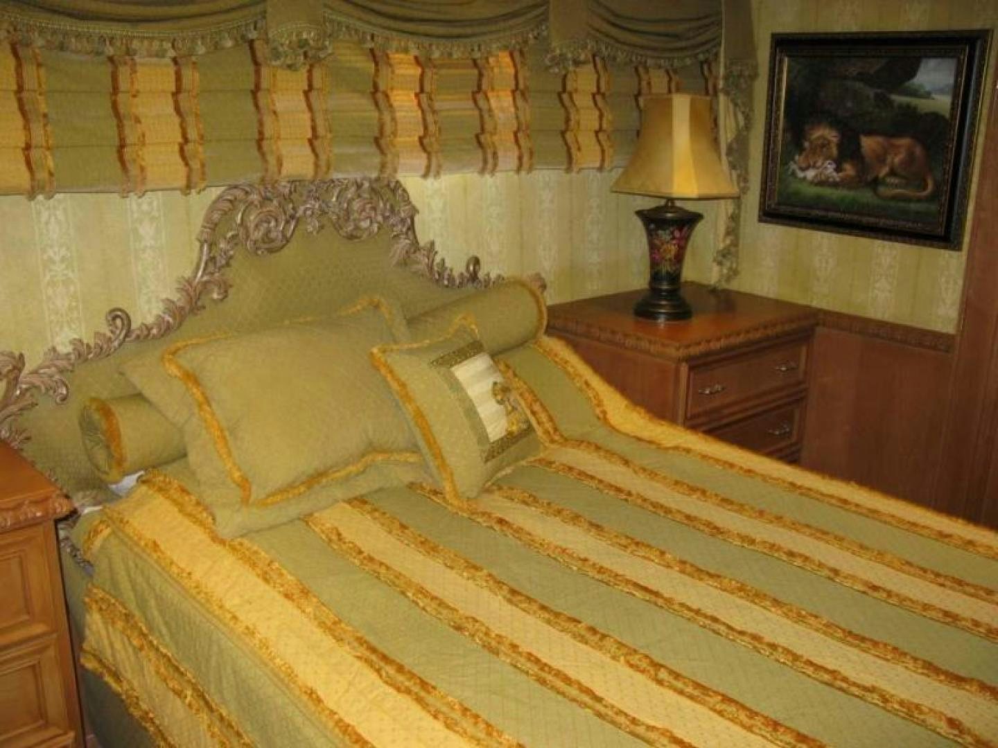 a bed with a yellow comforter aboard TRUE NORTH Yacht for Sale