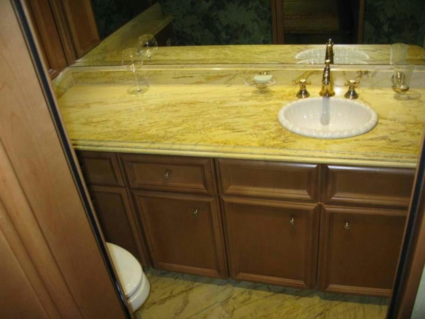 a bathroom with a sink and a toilet aboard TRUE NORTH Yacht for Sale